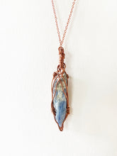 Load image into Gallery viewer, Blue Kyanite Wire-Wrapped Copper Pendant Necklace. Genuine Real Raw Crystal Gemstone Sourced in Asheville, North Carolina. Minimalist Modern Bohemian Style with Criss-Cross Design. Authentic One-of-a-Kind Handmade Jewelry.