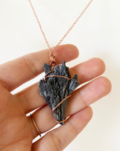 Load image into Gallery viewer, Black Kyanite Wire-Wrapped Copper Pendant Necklace. Genuine Real Raw Crystal Gemstone Sourced in Asheville, North Carolina. Minimalist Modern Bohemian Style Design. Authentic One-of-a-Kind Handmade Jewelry.