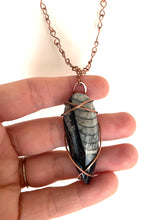 Load image into Gallery viewer, Ancient Orthoceras Fossial & Wire-Wrapped Antique Copper Pendant Necklace. Genuine Real Oblong Black Gemstone Sourced in Asheville, North Carolina. Minimalist Modern Bohemian Style Design. Authentic One-of-a-Kind Handmade Jewelry.