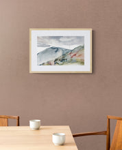 Load image into Gallery viewer, 10.25” x 16" original watercolor abstract landscape painting of foggy autumn mountains and cloudy sky in an expressive, minimalist, modern style by contemporary fine artist Elizabeth Becker. Muted soft gray, blue green and white colors. Framed in a room.