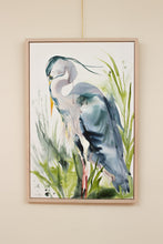 Load image into Gallery viewer, 24” x 36" original watercolor painting on canvas in 26" x 38" natural maple solid wood floater frame. Large-scale expressive Great Blue Heron water bird standing in marsh or lake. Expressive, impressionist, loose, watery, flowing, painterly, abstract, minimalist, modern, moody style by contemporary fine artist Elizabeth Becker. Monochromatic olive green, dark blue and white colors.