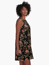 Load image into Gallery viewer, A-line or swing dress featuring original hand-painted watercolor painting by artist Elizabeth Becker. Flowy summer tent dress with floral design. Peach and olive green on black background. Botanical rose flowers and leaves.