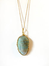Load image into Gallery viewer, Fluorite Wire-Wrapped Brass Pendant Necklace. Genuine Real Raw Crystal Gemstone Sourced in Asheville, North Carolina. Pale teal or soft blue-green color. Minimalist Modern Bohemian Style Design. Authentic One-of-a-Kind Handmade Jewelry.
