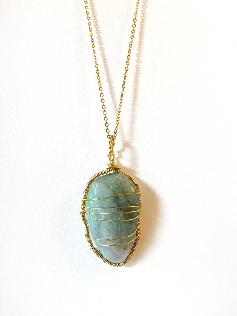 Fluorite Wire-Wrapped Brass Pendant Necklace. Genuine Real Raw Crystal Gemstone Sourced in Asheville, North Carolina. Pale teal or soft blue-green color. Minimalist Modern Bohemian Style Design. Authentic One-of-a-Kind Handmade Jewelry.