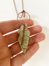 Load image into Gallery viewer, Pale Light Lime Green Calcite Wire-Wrapped Copper Pendant Necklace. Genuine Real Raw Crystal Gemstone Sourced in Asheville, North Carolina. Minimalist Modern Bohemian Style with Criss-Cross X Design. Authentic One-of-a-Kind Handmade Jewelry.
