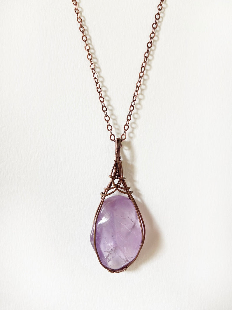 Amethyst Wire-Wrapped Copper Pendant Necklace. Genuine Real Raw Purple Crystal Gemstone Sourced in Asheville, North Carolina. Minimalist Modern Bohemian Style with Criss-Cross Design. Authentic One-of-a-Kind Handmade Jewelry.