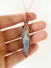 Load image into Gallery viewer, Blue Kyanite Wire-Wrapped Copper Pendant Necklace. Genuine Real Raw Crystal Gemstone Sourced in Asheville, North Carolina. Minimalist Modern Bohemian Style with Criss-Cross Design. Authentic One-of-a-Kind Handmade Jewelry.
