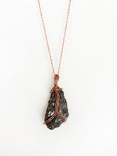 Load image into Gallery viewer, Black Diorite Wire-Wrapped Copper Pendant Necklace. Genuine Real Raw Crystal Gemstone. Foraged Rock Found on a Hike near Asheville in Western North Carolina. Minimalist Modern Bohemian Style with Circle Design. Authentic One-of-a-Kind Handmade Jewelry.
