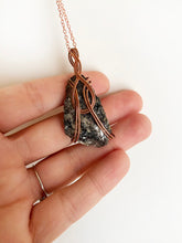 Load image into Gallery viewer, Black Diorite Wire-Wrapped Copper Pendant Necklace. Genuine Real Raw Crystal Gemstone. Foraged Rock Found on a Hike near Asheville in Western North Carolina. Minimalist Modern Bohemian Style with Circle Design. Authentic One-of-a-Kind Handmade Jewelry.
