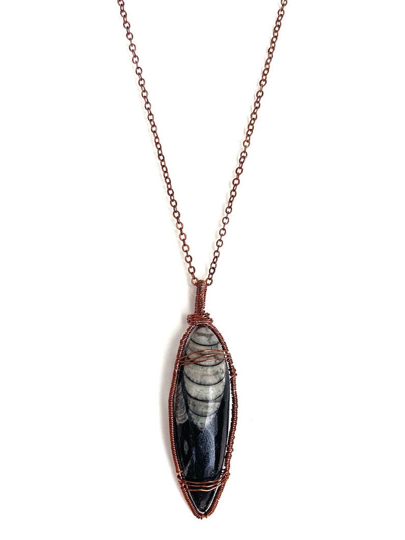 Ancient Orthoceras Fossial & Wire-Wrapped Antique Copper Pendant Necklace. Genuine Real Oblong Black Gemstone Sourced in Asheville, North Carolina. Minimalist Modern Bohemian Style Design. Authentic One-of-a-Kind Handmade Jewelry.