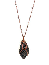 Load image into Gallery viewer, Black Pyroxenite Wire-Wrapped Antique Copper Pendant Necklace. Genuine Real Raw Crystal Gemstone. Foraged Rock Found on a Hike near Asheville in Western North Carolina. Minimalist Modern Bohemian Style with Circle Design. Authentic One-of-a-Kind Handmade Jewelry.
