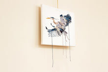 Load image into Gallery viewer, 11” x 14" original hand embroidery on canvas. Expressive flying great blue heron fiber art, in an intricate, meticulous, loose, sketch-like, minimalist, modern style with loose hanging threads by contemporary fine artist Elizabeth Becker. Monochromatic dark blue, gray and white colors.
