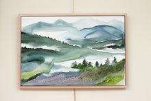 Load image into Gallery viewer, 24” x 36&quot; original watercolor painting on canvas in 26&quot; x 38&quot; natural maple solid wood floater frame. Abstract landscape of foggy misty mountain layers with pine trees in an expressive, impressionist, loose, watery, ethereal, minimalist, modern, moody style by contemporary fine artist Elizabeth Becker. Inspired by Asheville, North Carolina or Colorado. Muted monochromatic blue, green and white colors.
