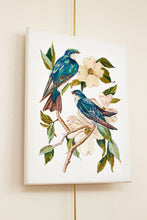 Load image into Gallery viewer, 11” x 14" original hand embroidery on canvas. Two tree swallow birds and botanical dogwood floral tree branches. Inspired by Audubon. Fiber art, in an intricate, meticulous, illustrative, minimalist, modern style by contemporary fine artist Elizabeth Becker. Monochromatic blue, green, teal, turquoise and white colors.
