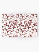 Load image into Gallery viewer, Hardcover journal featuring original hand-painted watercolor painting by artist Elizabeth Becker. Ruled line, graph or blank pages. Maroon red and white colors. Flying birds design.
