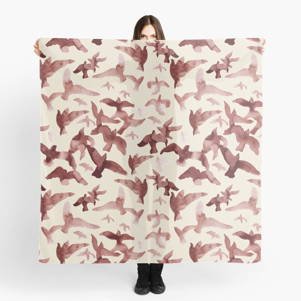 Scarf featuring original hand-painted watercolor painting by artist Elizabeth Becker. Maroon red and cream flying birds design.