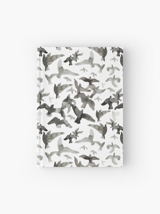 Hardcover journal featuring original hand-painted watercolor painting by artist Elizabeth Becker. Ruled line, graph or blank pages. Black and white colors. Flying birds design.