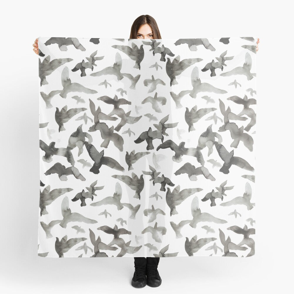 Scarf featuring original hand-painted watercolor painting by artist Elizabeth Becker. Black and white flying birds design.