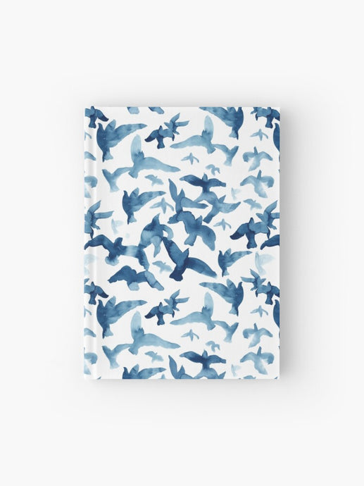 Hardcover journal featuring original hand-painted watercolor painting by artist Elizabeth Becker. Ruled line, graph or blank pages. Blue and white colors. Flying birds design.