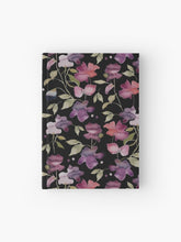 Load image into Gallery viewer, Hardcover journal featuring original hand-painted watercolor painting by artist Elizabeth Becker. Ruled line, graph or blank pages. Purple, pink, red and pale green on black background. Abstract floral. Flowers and leaves.
