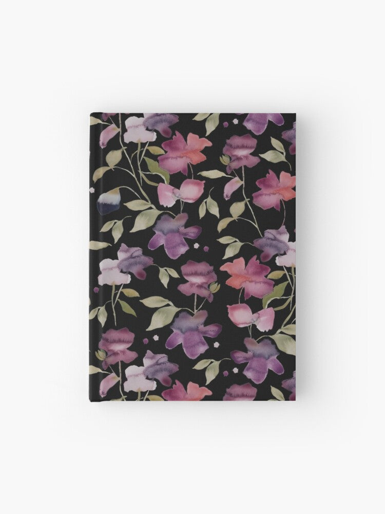 Hardcover journal featuring original hand-painted watercolor painting by artist Elizabeth Becker. Ruled line, graph or blank pages. Purple, pink, red and pale green on black background. Abstract floral. Flowers and leaves.