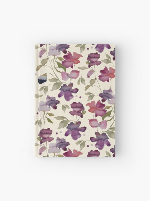 Hardcover journal featuring original hand-painted watercolor painting by artist Elizabeth Becker. Ruled line, graph or blank pages. Purple, pink, red and pale green on cream background. Abstract floral. Flowers and leaves.