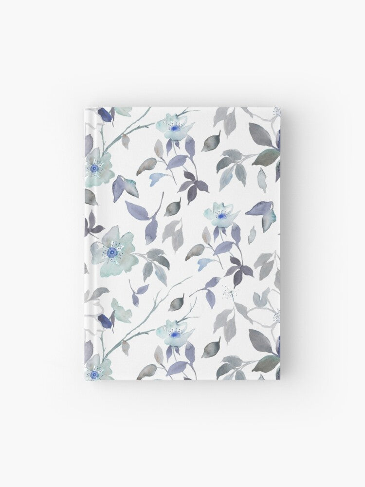 Hardcover journal featuring original hand-painted watercolor painting by artist Elizabeth Becker. Ruled line, graph or blank pages. Light blue, gray and white colors. Floral wild rose flowers, branches and leaves.