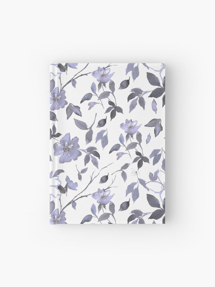 Hardcover journal featuring original hand-painted watercolor painting by artist Elizabeth Becker. Ruled line, graph or blank pages. Light lavender purple, gray and white colors. Floral wild rose flowers, branches and leaves.