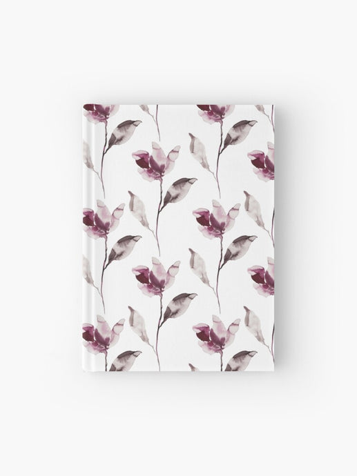 Hardcover journal featuring original hand-painted watercolor painting by artist Elizabeth Becker. Ruled line, graph or blank pages. Soft mauve purple, black and white colors. Botanical flowers and leaves. Floral design.