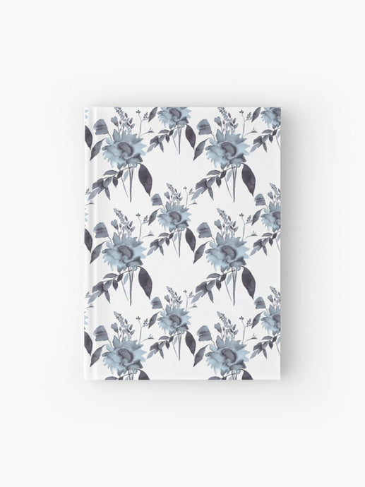 Hardcover journal featuring original hand-painted watercolor painting by artist Elizabeth Becker. Ruled line, graph or blank pages. Soft blue, gray and white colors. Botanical floral pattern. Flowers and leaves design.