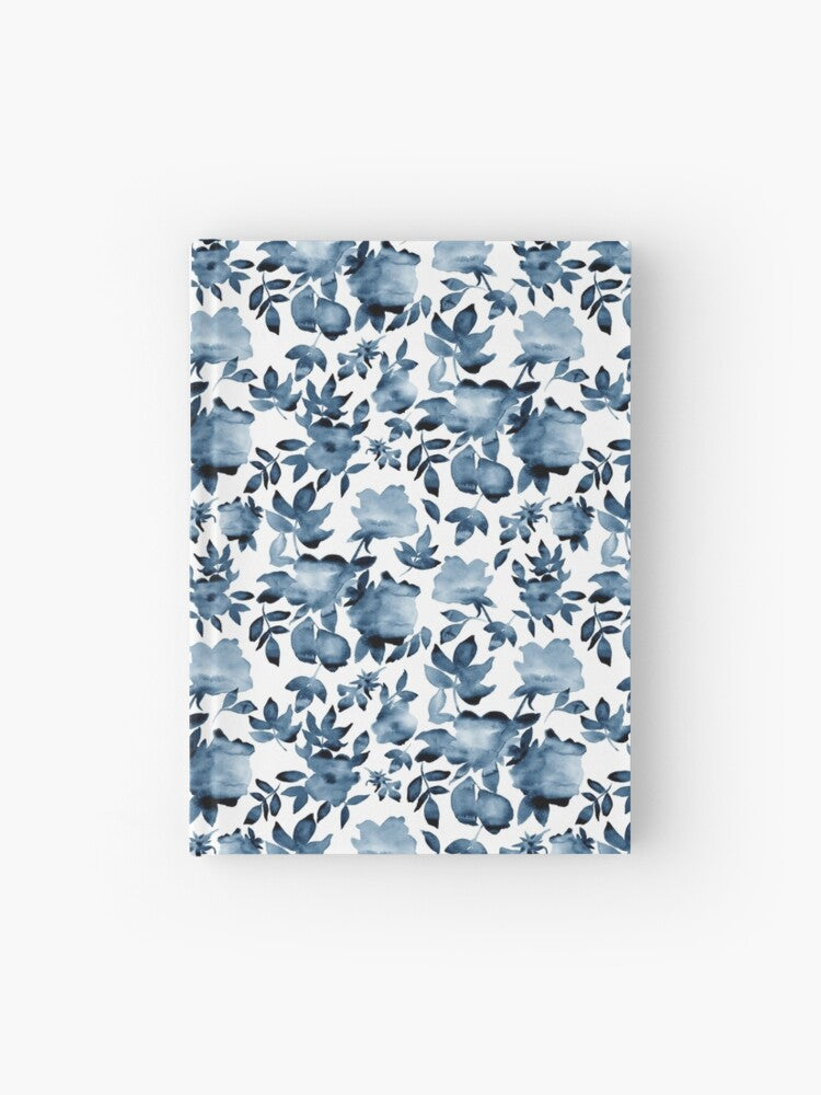 Hardcover journal featuring original hand-painted watercolor painting by artist Elizabeth Becker. Ruled line, graph or blank pages. Soft blue and white colors. Floral rose flowers and leaves.