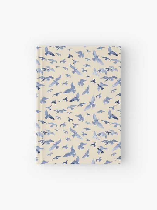 Hardcover journal featuring original hand-painted watercolor painting by artist Elizabeth Becker. Ruled line, graph or blank pages. Soft blue and cream colors. Flying birds design.