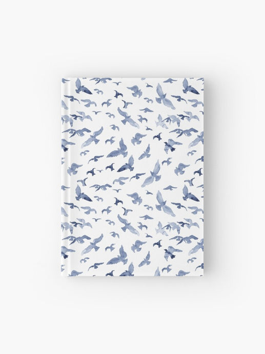 Hardcover journal featuring original hand-painted watercolor painting by artist Elizabeth Becker. Ruled line, graph or blank pages. Soft blue and white colors. Flying birds design.