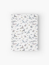 Load image into Gallery viewer, Hardcover journal featuring original hand-painted watercolor painting by artist Elizabeth Becker. Ruled line, graph or blank pages. Soft gray, light blue, pale mauve and white colors. Flying birds design.
