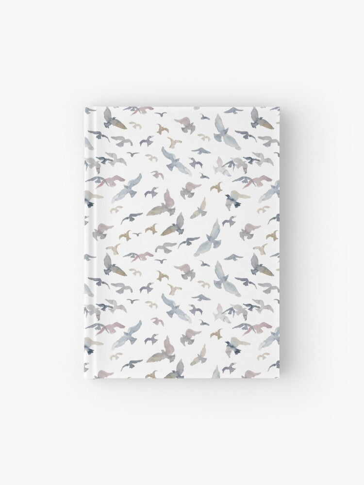 Hardcover journal featuring original hand-painted watercolor painting by artist Elizabeth Becker. Ruled line, graph or blank pages. Soft gray, light blue, pale mauve and white colors. Flying birds design.